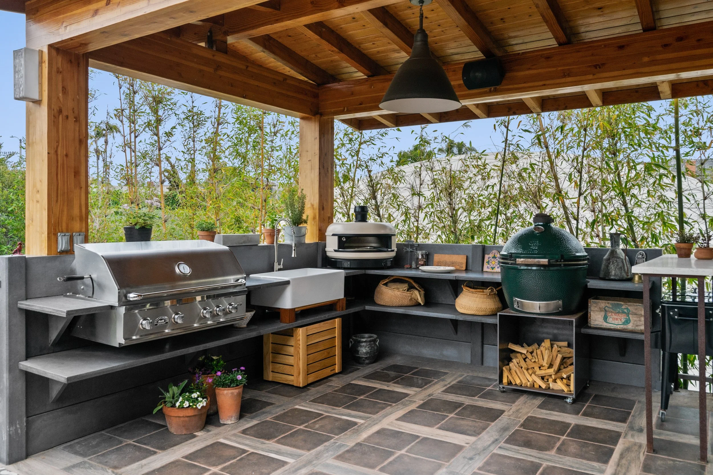 Built-in grill and stone countertop in a custom outdoor kitchen
